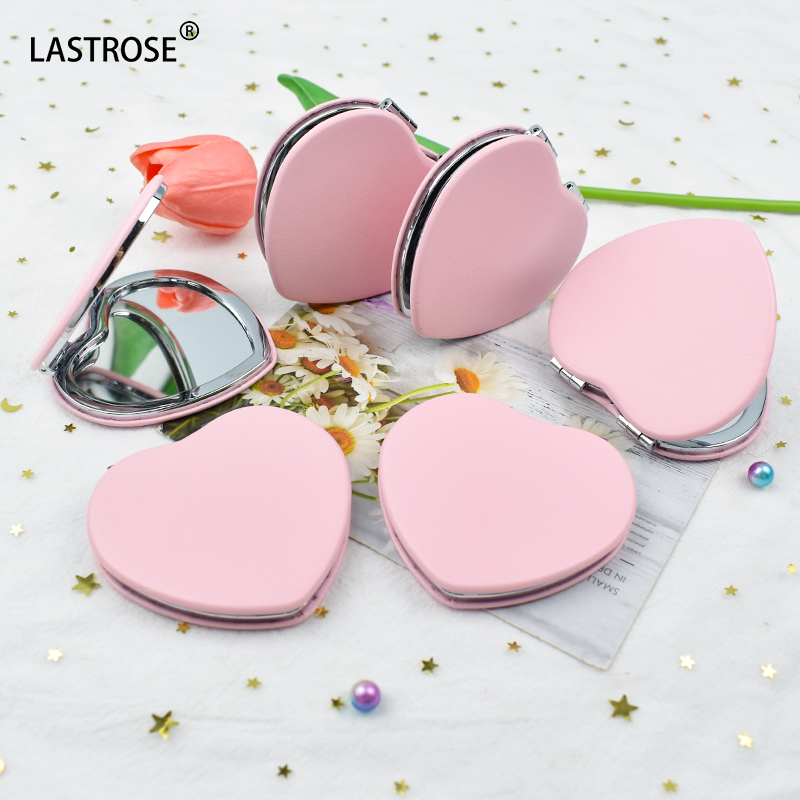 espejo de corazón rosa