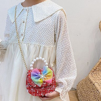 Nouveau sac bandoulière tendance pour petites filles, style princesse mignon, mini sac messager avec fermeture à nœud perlé, porte-monnaie, sac à bandoulière