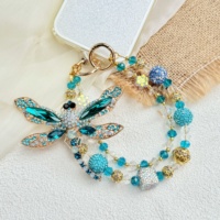 Breloque de téléphone perlée fleur bleue, cordon de poignet double couche pour téléphone, perles imitation nacre, porte-clés fait main, pendentif de sac, décoration