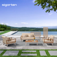 Ensemble de jardin Sigarten en teck et acrylique 4 pièces avec un siège confortable, un fauteuil et une table basse