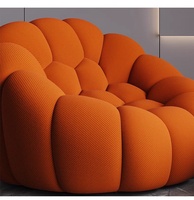 Fauteuil individuel de relaxation Roche Bobois Bubble Comfort, design moderne et luxueux, avec accoudoirs rouges, pour salon
