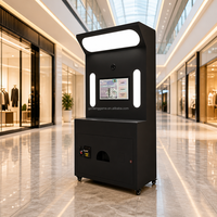 Imprimante portable noire mate à écran tactile avec appareil photo et Bluetooth pour impression instantanée, idéale pour la location en cabine photo lors de fêtes, événements et centres commerciaux