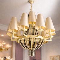 Lustre de luxe de style américain moderne en acier inoxydable doré et cristal K9 avec base d'ampoule E12 pour la décoration d'hôtels et de villas