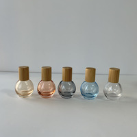 Vente en gros 10ml bouteille en verre à rouleaux en forme de boule ronde bleu orange jaune gris clair avec bouchon en bambou