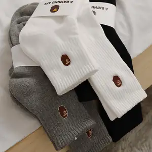 Calcetines deportivos de algodón con logotipo bordado para hombre y mujer, calcetín unisex de diseño personalizado con mangas bordadas