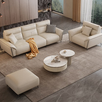 Ensemble de meubles de salon en cuir crème de luxe moderne, canapé 3 places, fauteuil, ottoman, table basse en marbre, salon, hôtel, commercial