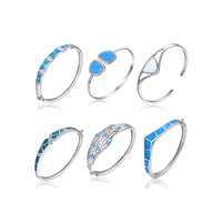 Bracelet en opale enchanteur en argent 925: le feu pastel brille dans la pierre, encadré par de l'argent, la beauté qui bouge à chaque geste