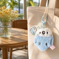 Porte-clés artisanal en tissu bleu clair, perroquet en peluche mignon et moelleux, breloque de sac avec pendentif en acrylique pour la décoration de sac à dos