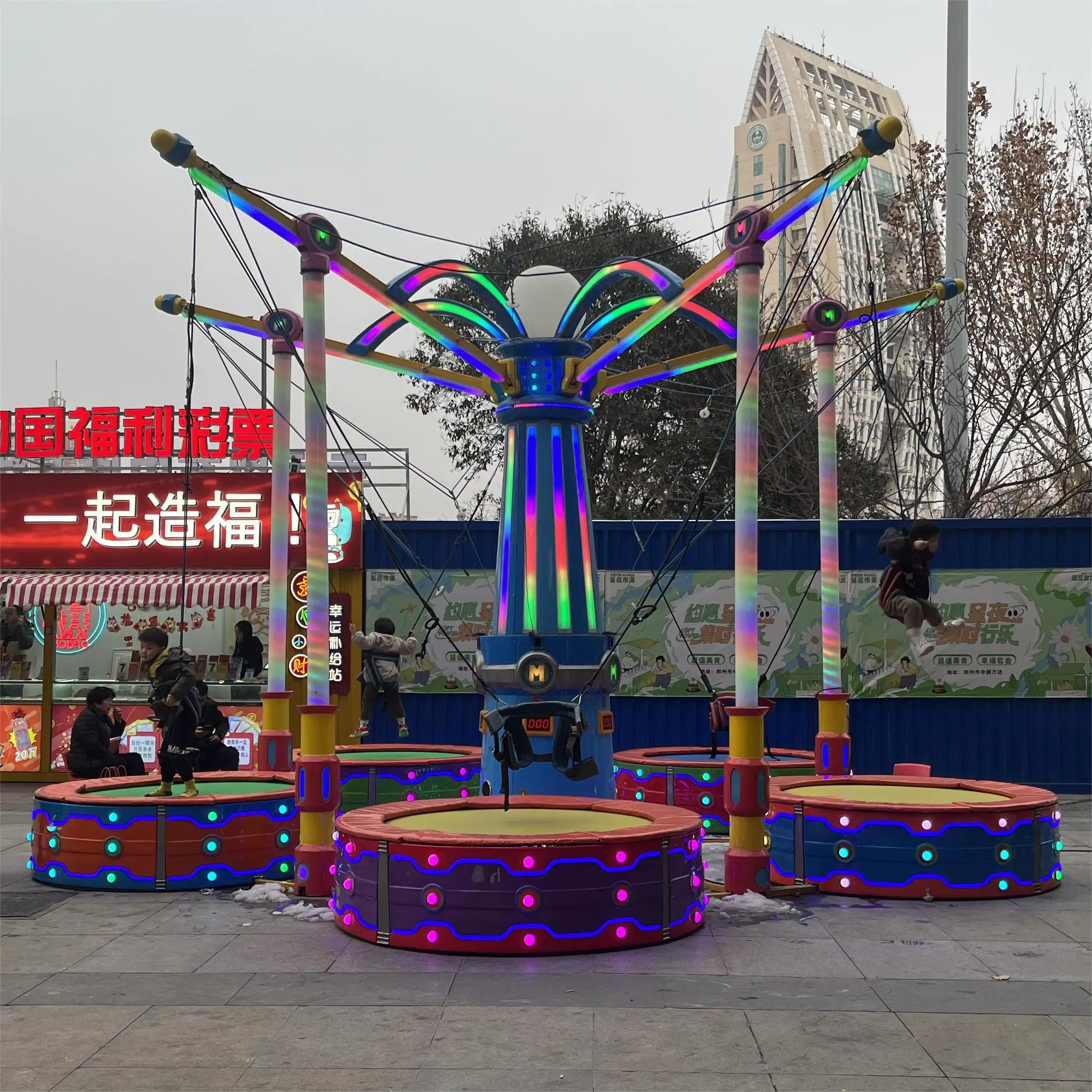 china factory low price entertainment equipment kiddie rides bungee trampoline on trailer inflatable bungee jump