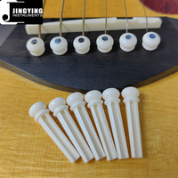 Usine Jingying Vente en gros Os de bovin naturel incrusté de coquille d'ormeau Clous de cordes de guitare acoustique Goupilles de pont pour guitare folk