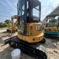 Mini-pelleuse Caterpillar 303.5 d'occasion à faible nombre d'heures de fonctionnement, 3,5t, hydraulique, avec chenilles en caoutchouc durables pour la ferme