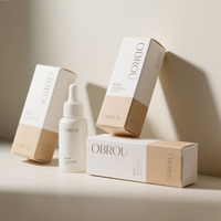 Boîtes en carton auto-érectables mates OBROU, imprimées quadricolore et gaufrées argentées pour emballages cosmétiques personnalisés en détail