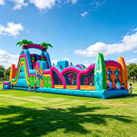 Structure gonflable pour enfants avec toboggan, aire de jeux extérieure, parcours d'obstacles, location pour fêtes et divertissement