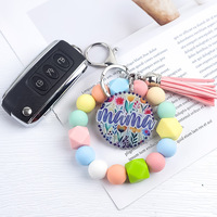 Nouveauté 2026 : Porte-clés en silicone perlé style mignon, avec pompon en PU hexagonal, pour bracelets et porte-clés – Vente en gros