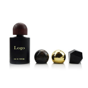 Botella <span class=keywords><strong>de</strong></span> <span class=keywords><strong>Perfume</strong></span> <span class=keywords><strong>de</strong></span> Vidrio Vacía Personalizada <span class=keywords><strong>de</strong></span> 30ml 50ml 100ml, Forma Redonda, Negra, con Tapas <span class=keywords><strong>de</strong></span> Madera - Product Image 1