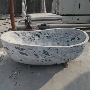Baignoire en pierre naturelle sculptée à la main baignoire ronde en marbre autoportante pour projet d'hôtel de salle de bain