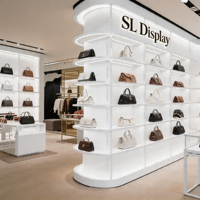 Vitrine d'exposition de sacs en cuir pour centre commercial, éclairage LED moderne de luxe personnalisé 2025