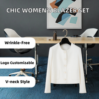 Ensemble deux pièces pour femme : veste de costume à manches longues et jupe mi-longue, fermeture simple boutonnée, couleur unie, idéal pour le bureau ou les soirées.