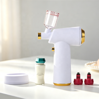 Pistolet de pulvérisation professionnel pour salons avec atomisation ultrasonique et station de charge inductive sans fil