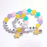 Conjunto de pulsera de color caramelo Popular de cuatro dinosaurios de dibujos animados colgante con cuentas conjunto de pulsera para niños