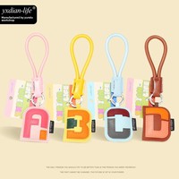 Porte-clés de voiture en cuir PU véritable 5ème génération avec pendentif sac à lettres, best-seller transfrontalier, 26 lettres anglaises, durable