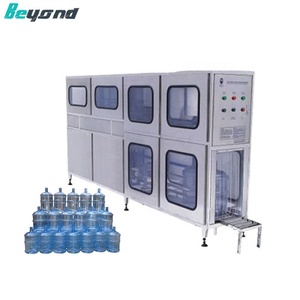 Machine de remplissage de scellage de nettoyage de tambour à grande vitesse 150BPH 19L avec système de bande transporteuse pour jerrycans en PET - Product Image 1