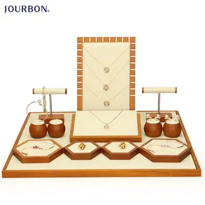 Espositori per gioielli di moda Jourbon per negozio espositore per gioielli di lusso puntelli Set di espositori per gioielli marrone kaki in legno massello personalizzato