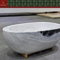 Baignoire ovale autoportante en marbre blanc Panda GOLDKING, design contemporain, veinure noire audacieuse, polissage CNC OEM, sur mesure