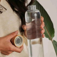 Bouteilles d'eau en verre borosilicaté de 1 litre 550ml 18oz 25oz 32oz personnalisées durables et écologiques portables avec manchon et couvercle en bambou