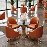 Ensemble de mobilier de restaurant moderne et luxueux, respectueux de l'environnement, table et chaises de café, pieds en acier inoxydable doré, cuir PU, école