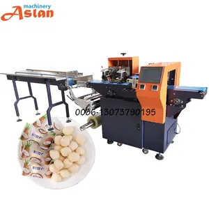 Máquina empacadora automática de tipo almohada de caramelo de leche Galletas Cuchara Máquina empacadora de flujo de miel - Product Image 1