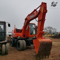 Vente Flash : Excavatrice sur pneus Doosan DH150 d'occasion, 15 tonnes, système hydraulique complet, bon état, livraison rapide, expédition mondiale