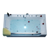 Baignoire à remous en acrylique élégante de 1500 mm pour une personne avec panneau latéral transparent, bain de massage ergonomique avec drain