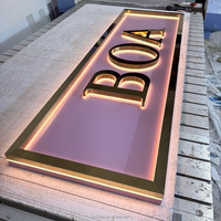 Enseigne murale lumineuse en métal 3D avec logo en relief, cadre doré, fond rose, pour boutique de vêtements, devanture de magasin