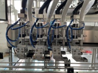 Machine automatique électrique à commande PLC haute productivité pour le conditionnement de cosmétiques et de boissons (miel, shampoing, jus, huile) en bouteilles plastiques/verres