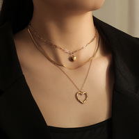 Nouveau Style multicouche en acier inoxydable chaîne cubaine collier plaqué or amour pendentif os chaîne collier pour femmes cadeau