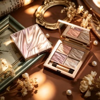 Palette de fards à paupières de luxe rose gold 4 couleurs avec couvercle à motif marbré et applicateur éponge pour les looks quotidiens