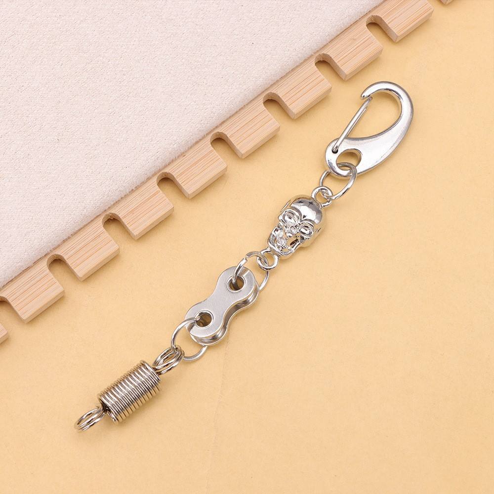 Skull-shaped spring D-ring