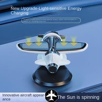 2025 décorations de Console de tableau de bord de voiture moderne ornement d'avion rotatif solaire assainisseurs d'air motif de bâton nouveau Design en plastique