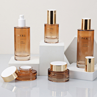 Nouveau Style luxueux ovale fond épais cristal bouteille cosmétique en verre personnalisé couvercle ambre translucide peut être personnalisé or mat