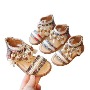 2023 été nouveau cent filles Style ethnique princesse sandales moyen enfant gland fond souple chaussures de plage fille