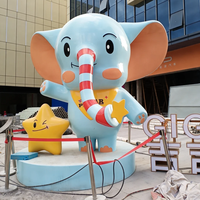 Sculpture géante en fibre de verre d'éléphant de dessin animé, mascotte mignonne, statue de personnage d'éléphant bleu pour centre commercial, place publique, parc d'attractions pour enfants