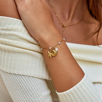 Bracelet en acier inoxydable plaqué or 18 carats, étanche, avec breloques étoile de mer, coquillage et perle, pour femme - Vente en gros de bijoux de mode