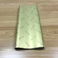 Papier d'emballage en tissu coloré de marque imprimé avec un logo doré/blanc/noir de luxe