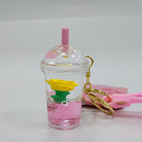 Porte-clés compact en forme de tasse de thé au lait, personnalisé avec flotteur liquide coloré, motif dessin animé, idéal pour la décoration, accessoire de sac, cadeau pour la maison