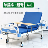 Lit d'hôpital avec roulettes, matelas, barrière de sécurité, table à manger et support de perfusion