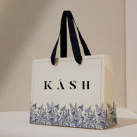 Emballage de sacs en papier personnalisé Vente en gros Sac en papier recyclable de luxe imprimé Sac en papier de haute qualité pour vêtements avec poignée