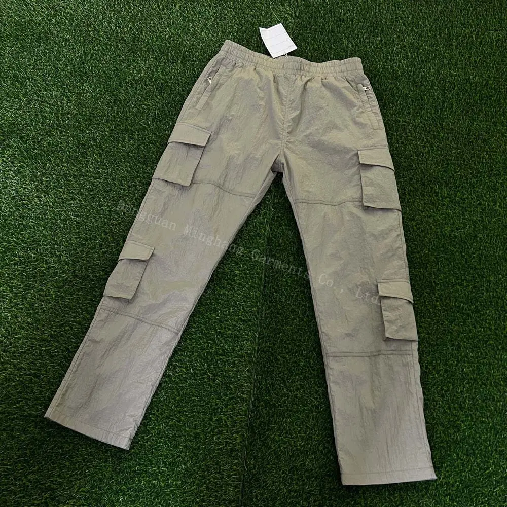 Pantalon personnalisé en nylon léger avec poches zippées Pantalon cargo à taille élastique pour hommes