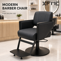 Fauteuil de Barbier de Luxe XFMC Entièrement Noir avec Cadre Métallique Noir, Chaise de Coiffure Pivotante à Levage Hydraulique pour Poste de Salon