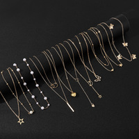 Parure de colliers vintage en alliage doré avec pendentifs papillon, étoile, cœur et perle, chaîne multi-styles pour femme, idéale au quotidien